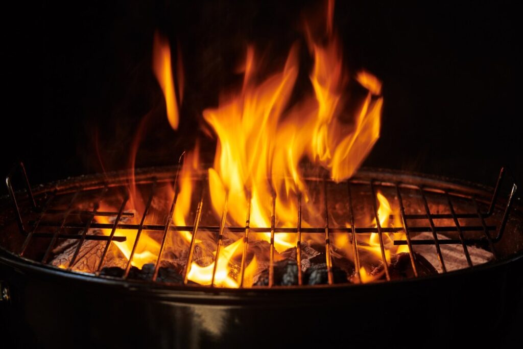 grill-background-barbecue-fire-grill-close-up-isolated-black-background_1150-37783